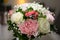 Wedding bride groom rings in marriage flowers bouquet