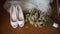 Wedding bride shoes on a background of bride bouquet.
