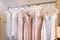 Wedding and bridesmaids dresses hanging on a metal hanger