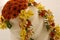 Wedding cake covered with flowers