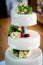 Wedding cake decorated with berries and flowers