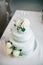 Wedding cake with flowers yellow beige turquoise green