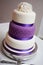 Wedding cake with purple mid tier