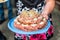 Wedding Cake raw ground pork cuisine burgers on tray with onion, rosemary and bread served on a wedding close-up