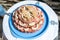 Wedding Cake raw ground pork cuisine burgers on tray with onion, rosemary and bread served on a wedding close-up