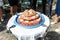 Wedding Cake raw ground pork cuisine burgers on tray with onion, rosemary and bread served on a wedding close-up