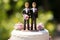 Wedding cake topper with two grooms, figurines of a gay couple. Gay marriage concept. Same-sex gay marriage, wedding sweets and