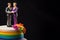 Wedding cake topper with two grooms, figurines of a gay couple. Gay marriage concept. Same-sex gay marriage, wedding sweets and