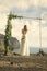 Wedding ceremony on the bahamas. Pretty girl or beautiful bride in white dress under arch