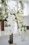 Wedding ceremony in the chapel for intimacy family and friends. Sunny outdoors afternoon natural light. Flowers arrangement for de