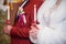 Wedding ceremony in church, young married couple holding the candles, christian traditions