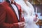 Wedding ceremony in church, young married couple holding the candles, christian traditions