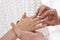 Wedding ceremony.A man puts a wedding ring on a girl`s finger.