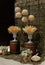 Wedding ceremony in a military style with wicker lamps, baskets with daisies, vases with dry wheat on wooden barrels