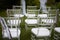 Wedding ceremony in the open air.Transparent chairs with fluttering ribbons in the Park or forest.