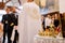 Wedding ceremony in an Orthodox church. The groom, the best man and the priest in a cassock stand in the church at the