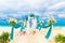 Wedding ceremony on a tropical beach in blue. Happy groom and br