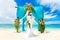 Wedding ceremony on a tropical beach. Happy bride under the wedding arch