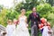 Wedding couple with flower children on bridge