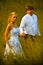 Wedding couple in grassy field