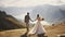 Wedding couple holding hands together at sunny day in mountains, dressed in elegant wedding outfits