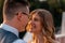 Wedding couple looking at each other with love and happiness at park at sunset time