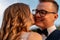 Wedding couple looking at each other with love and happiness at park at sunset time