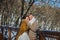 Wedding couple in a showy wither day, holding each other, rustic style short wedding dress. Girl brunette. beautiful bride winter