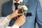 Wedding day. The groom gives the bride a bouquet. The first meeting on the day of the ceremony