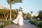 Wedding day is here. Bride luxury white wedding dress sunny day tropic nature background. Tropic wedding. Woman pretty