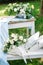 The wedding decor of the bride`s morning boudoir. Table and bench decorated with delicate flower compositions and bouquets of