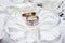 Wedding. Decor. Bride`s shoes, a beautiful wedding bouquet, rings, boutonniere and jewelry are beautifully laid out on a
