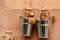 Wedding decor buckets with dried flowers on the background of a shabby wall