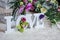 Wedding decor, LOVE letters and flowers on table. Fresh flowers and LOVE decoration on festive table. Luxurious wedding decoration