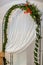 Wedding decoration - arch, white lace with green leaves