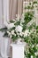 Wedding decoration, ceremony in a light tent. Gorgeous bouquet of different flowers. White floral arrangement in vintage