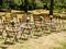 Wedding decoration chairs in rustic green style. Wedding ceremony outdoors