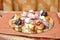 Wedding decoration with colored cupcakes, meringues and muffins. Elegant and luxurious event arrangement with colorful cakes