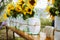 Wedding decoration details of sunflowers in mason jars