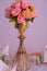 Wedding decoration flower that is on the metallic decorated stand