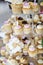 Wedding decoration with pastel colored cupcakes, meringues, muffins and macarons. Elegant and luxurious event arrangement