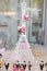 Wedding decoration with pink roses on Eiffel tower miniature. Elegant and luxurious event arrangement with La tour Eiffel