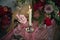 Wedding decorations. A burning candle in a candlestick in the center of the frame on a festive table.