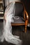 Wedding diadem and veil on the chair