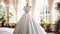 Wedding drees, bridal gown style and bespoke fashion, full-legth white tailored ball gown in showroom, tailor fitting