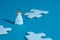 Wedding dress alternative. Miniature people women standing in the middle of puzzle jigsaw on blue background