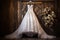 wedding dress on a hanger with a rustic barn wood background