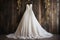 wedding dress on a hanger with a rustic barn wood background