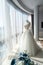 Wedding dress on a mannequin in panorama window.