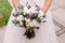 Wedding dress, wedding rings, wedding bouquet